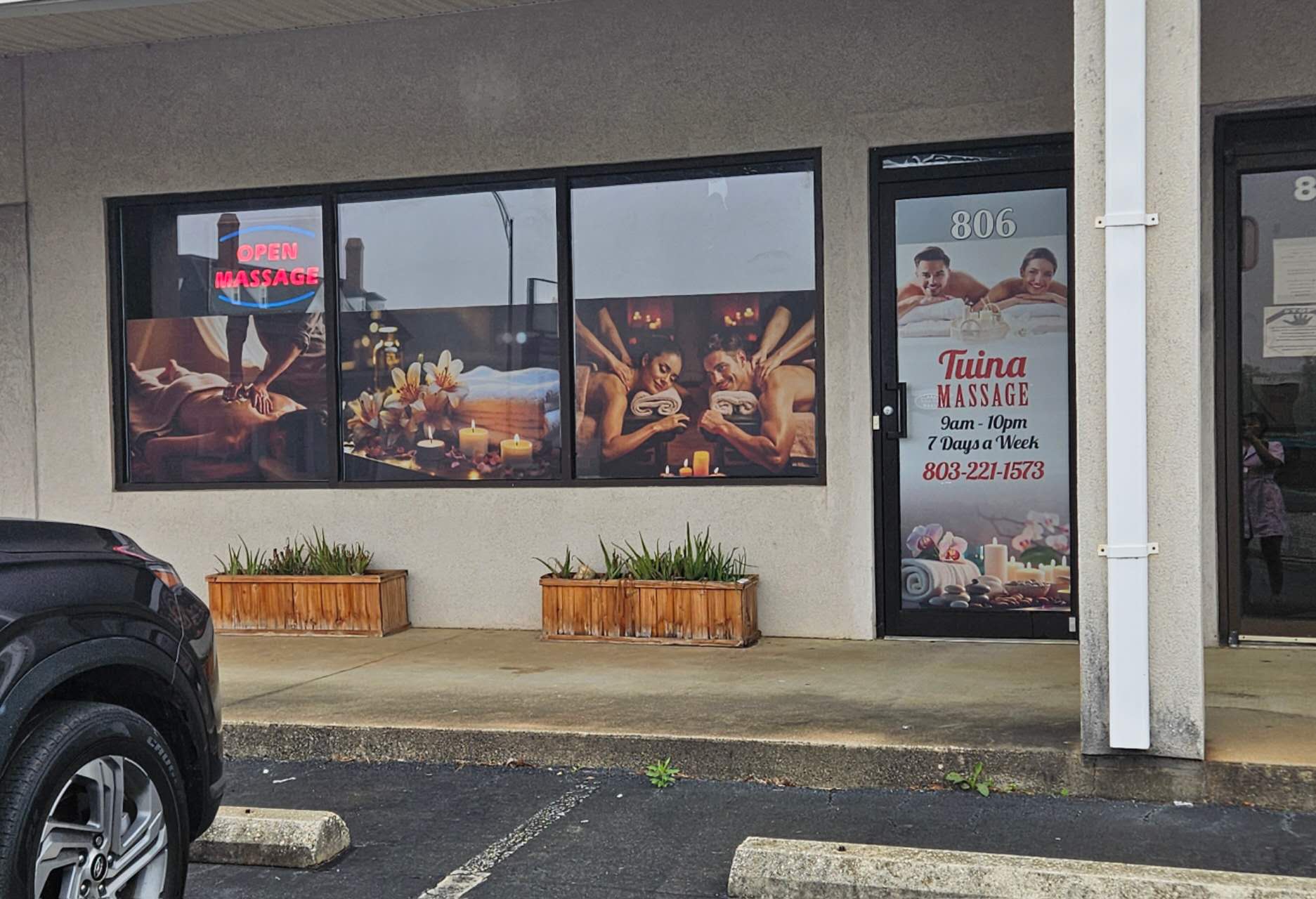 Our shopfront at 806 N Main St with the open sign lit