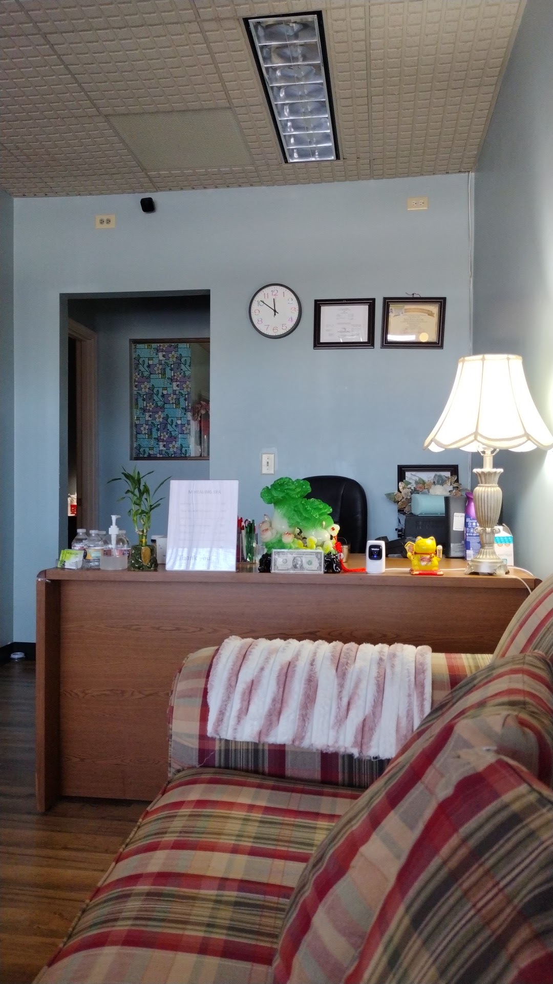 Our front desk and waiting sofa
